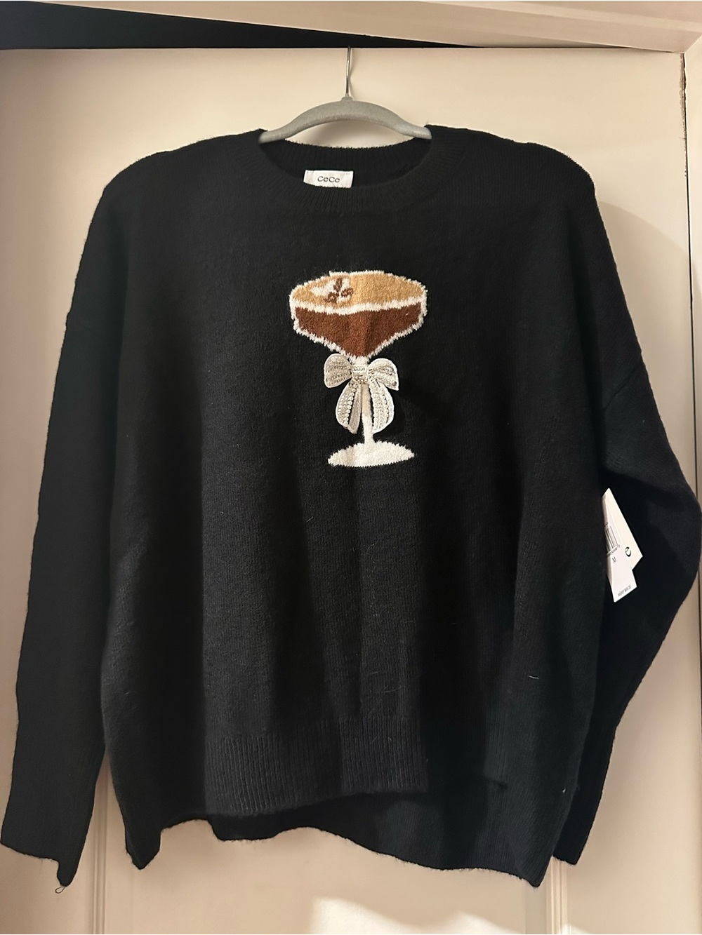 CeCe Black Crewneck Sweater with Champagne Glass Embroidery
Size M